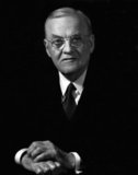 John Foster Dulles (February 25, 1888 – May 24, 1959) served as U.S. Secretary of State under President Dwight D. Eisenhower from 1953 to 1959.<br/><br/>

He was a significant figure in the early Cold War era, advocating an aggressive stance against communism throughout the world. He advocated support of the French in their war against the Viet Minh in Indochina and it is widely believed that he refused to shake the hand of Zhou Enlai at the Geneva Conference in 1954.<br/><br/> 

He also played a major role in the Central Intelligence Agency operation to overthrow the democratic Mossadegh government of Iran in 1953 and the democratic Arbenz government of Guatemala in 1954